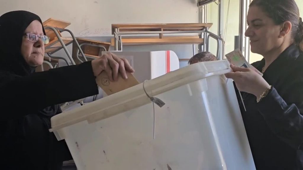 Voter casting ballot